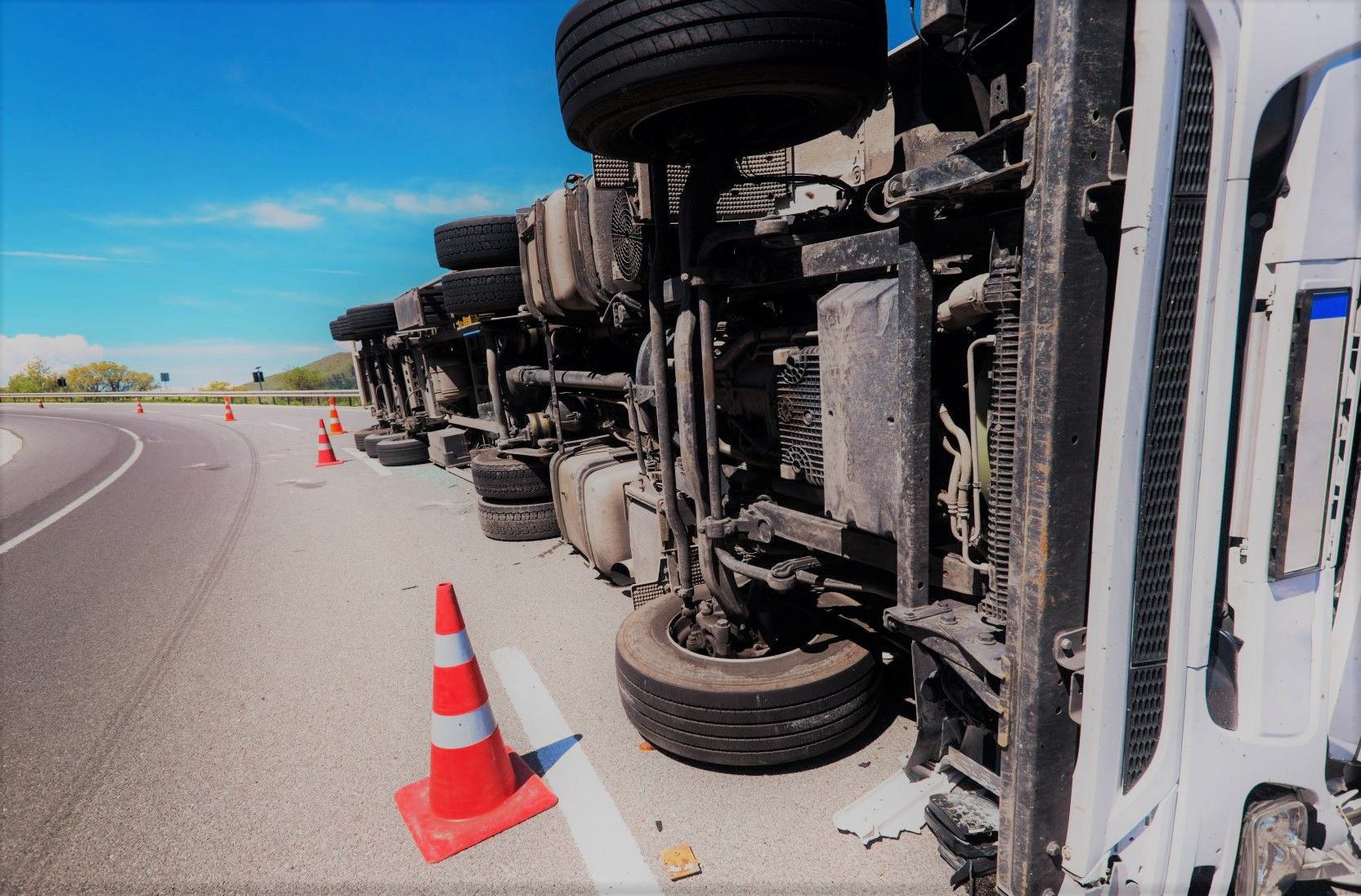 crashed truck on side of highway